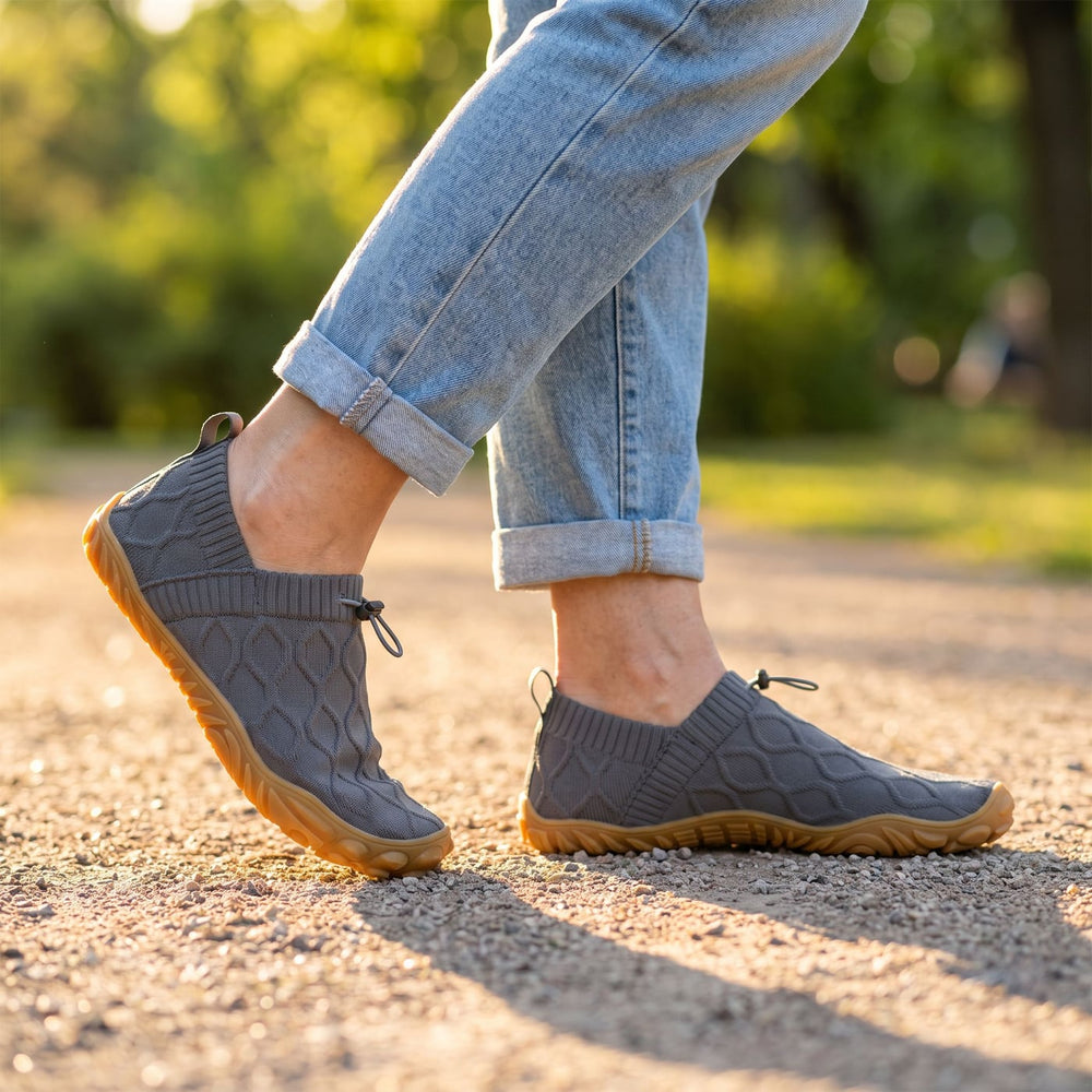 StrideFlex Wide in grey, walking on a park path