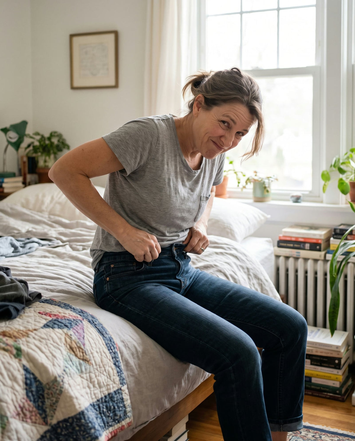 Woman struggling to close her jeans
