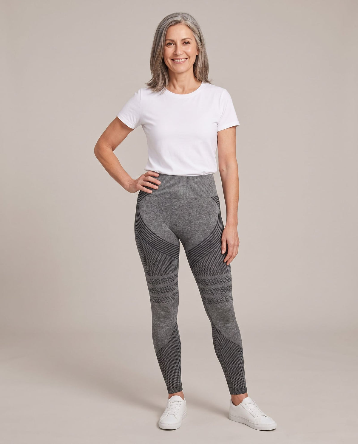 Smiling woman in her fifties wearing the grey CelluFit Sculpt Legging
