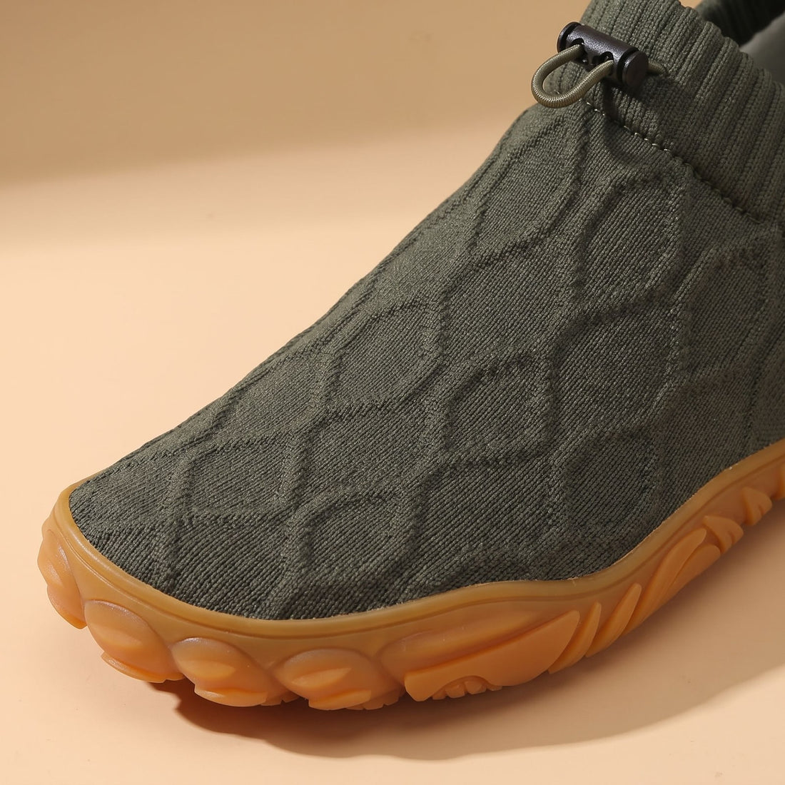 Detail: soft knit, drawcord and gum sole