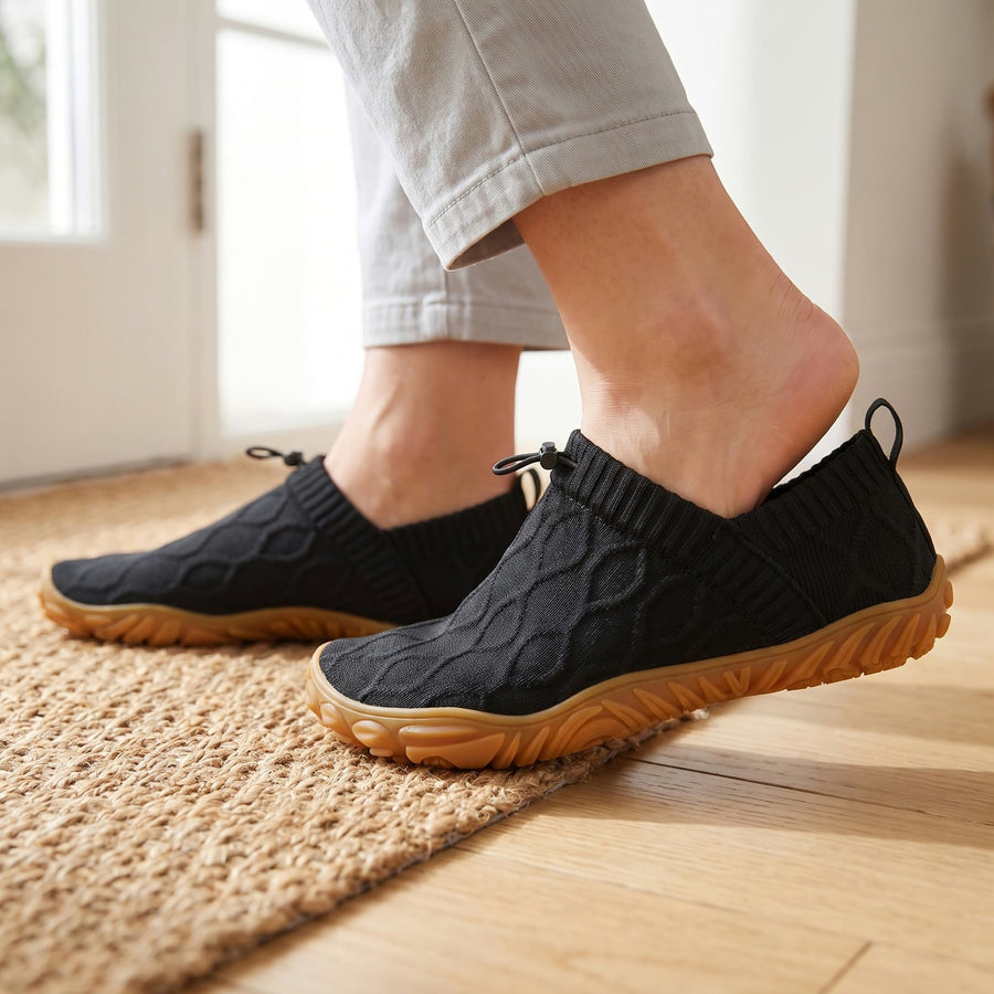 Stepping into a black StrideFlex slip-on without using your hands