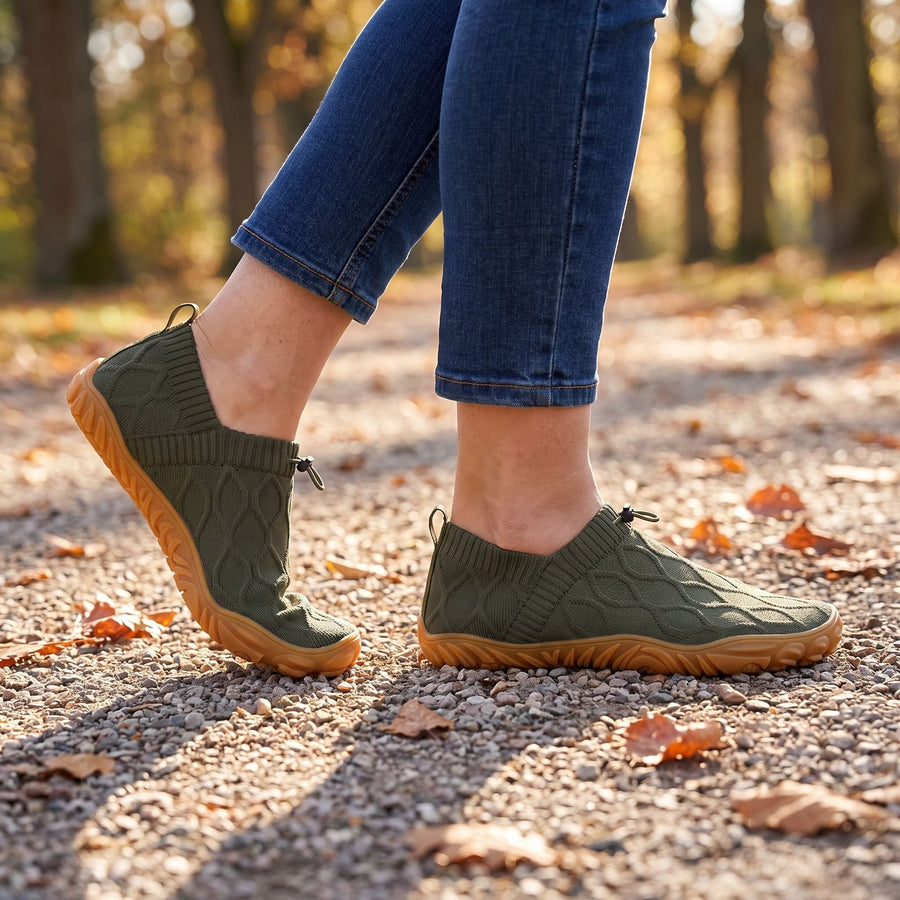 Walking in olive StrideFlex shoes on a gravel path